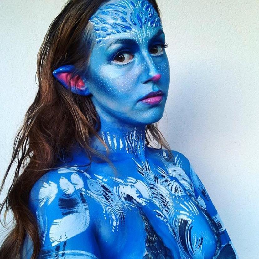 Blue fantasy full-face and body paint with white detailing