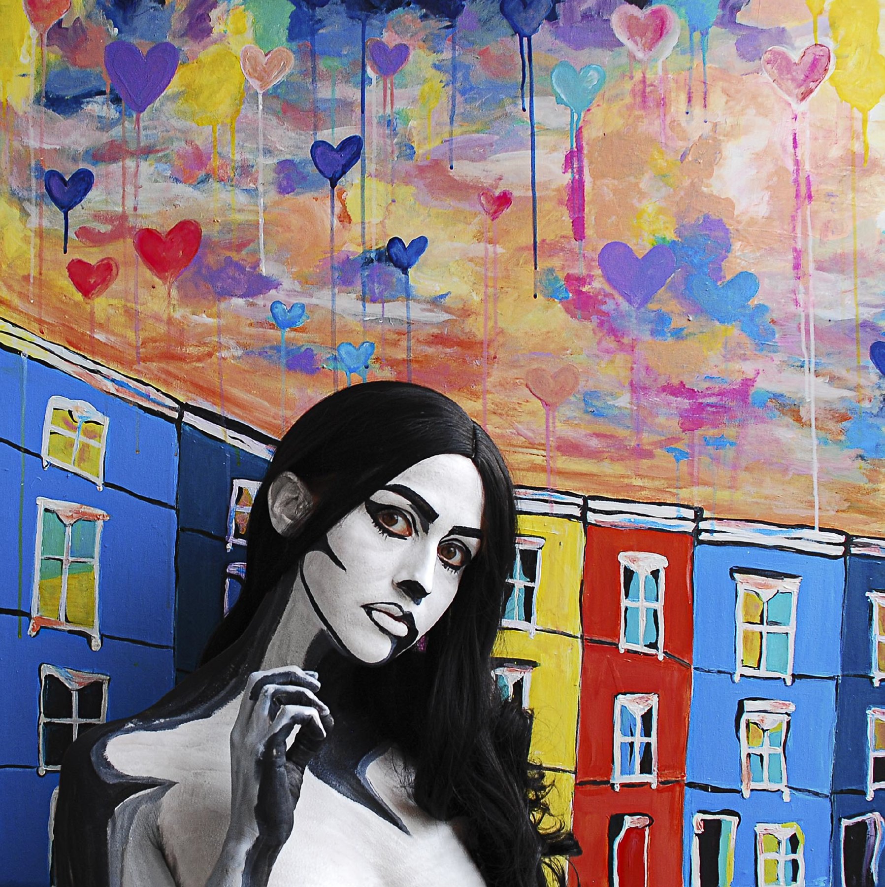 Monochrome pop-art body paint in front of Jess's hearts-and-houses mural